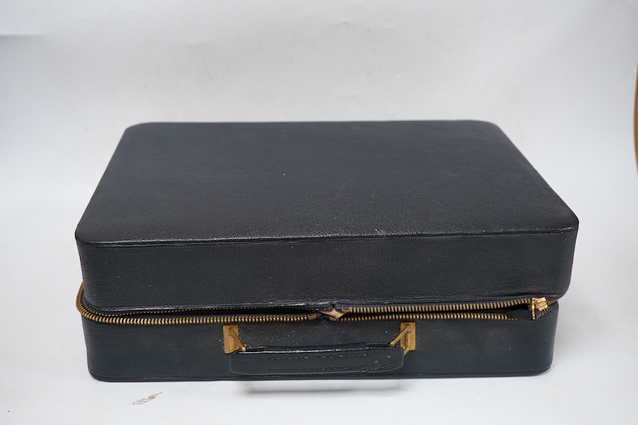 A George V/George VI Art Deco vanity case containing nine silver and blue guilloche enamel mounted items including a hand mirror, brushes, nail implement etc. Walker & Hall, 1936/37, incomplete.